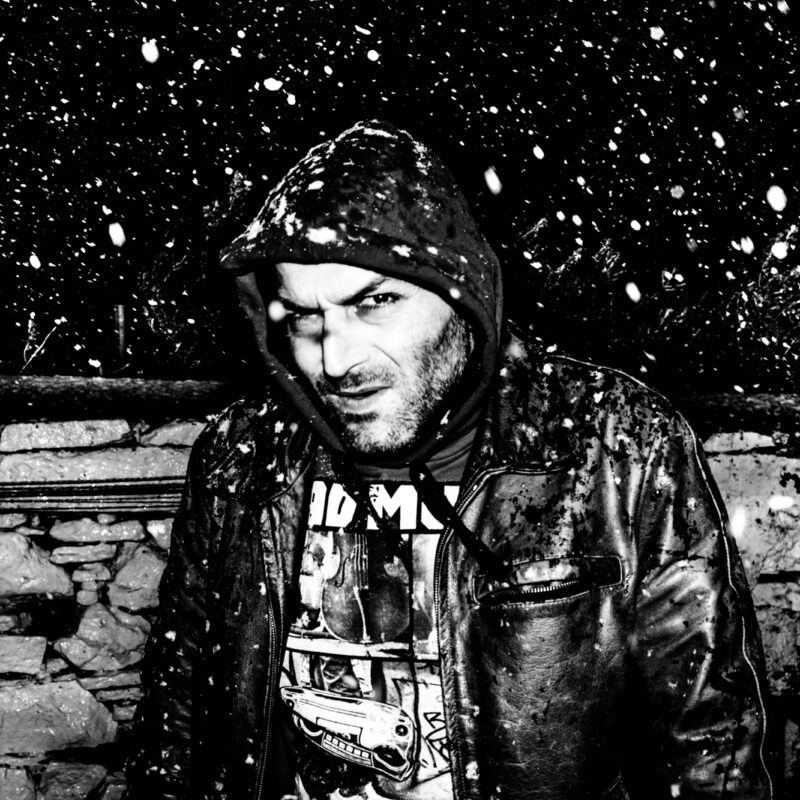 Black and white fine art photograph of a man in the snow exploring solitude and endurance by Eleni Onasoglou.